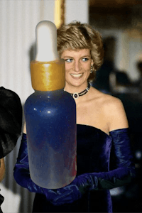 princess diana holding a bottle of liquid